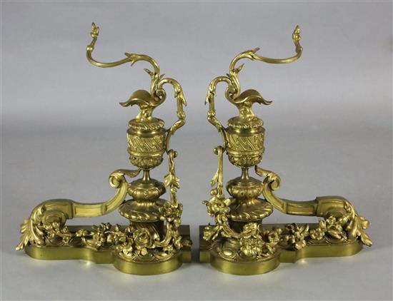 A pair of Louis XVI style ormolu chenets, width 16in. height 21in.